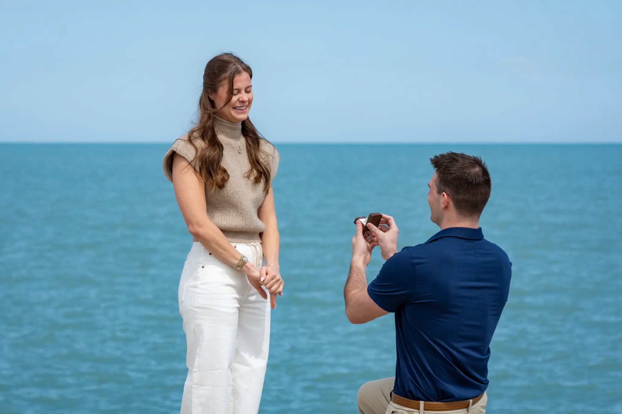 Tom proposing to Anna by the water